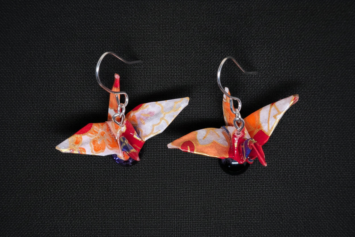 Orange and red, purple accented crane earrings