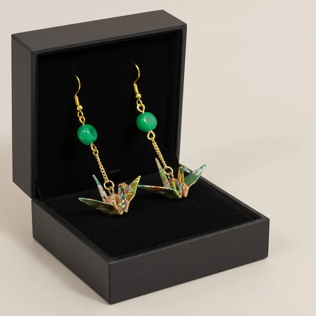 Butter Moon Creations LLc green floral washi paper origami crane earrings with malachite-style beads and gold-tone chain.