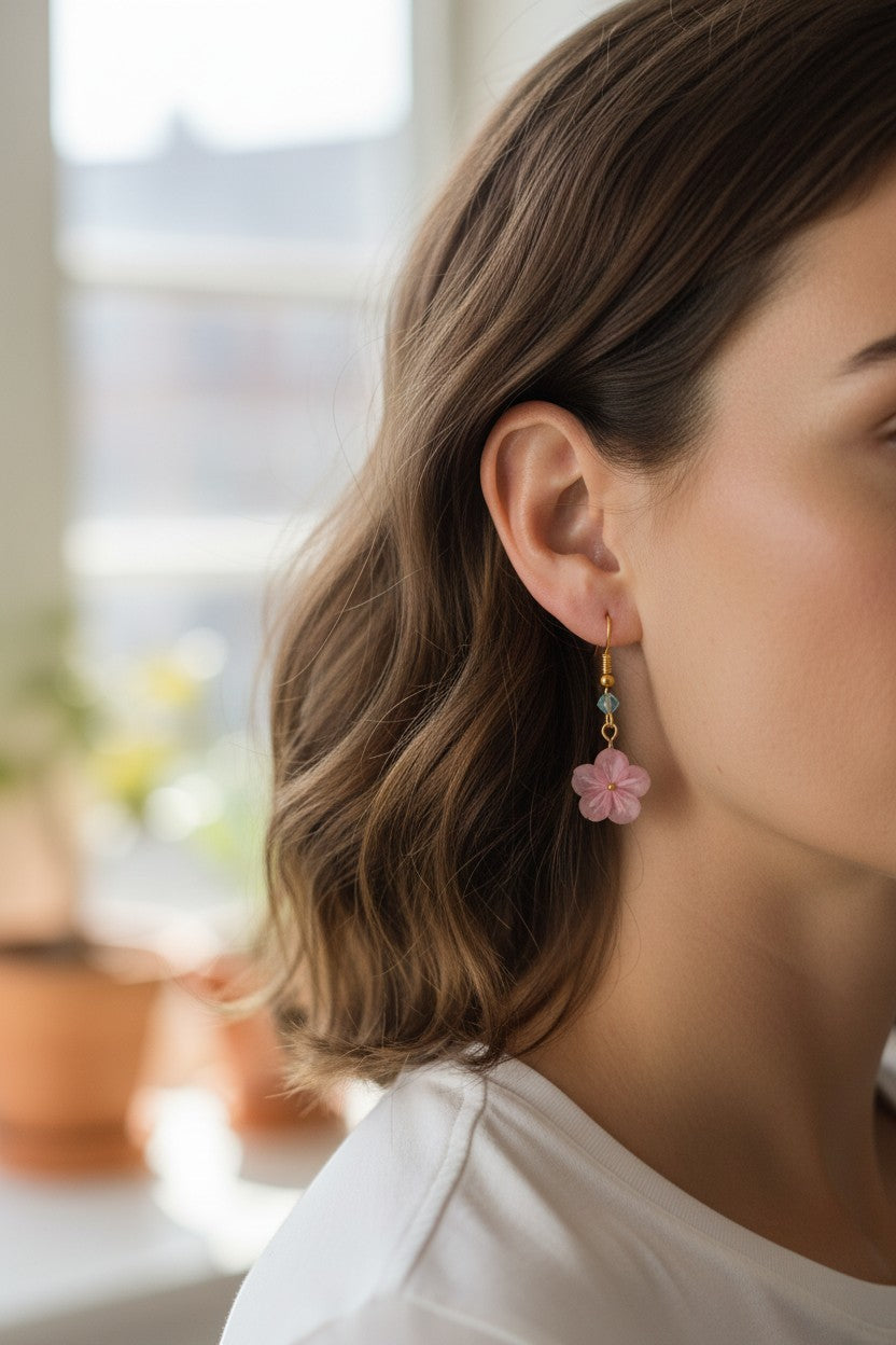 Butter Moon Creations, LLC pink fabric floral dangle earrings with blue bead accents.