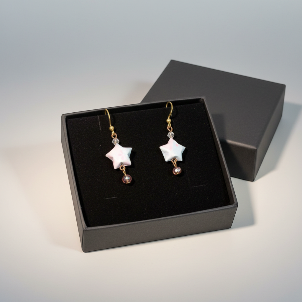 Butter Moon Creations, LLCHandmade Japanese Washi paper star earrings in pink and blue with rose crystal dangles and antique brass hooks.